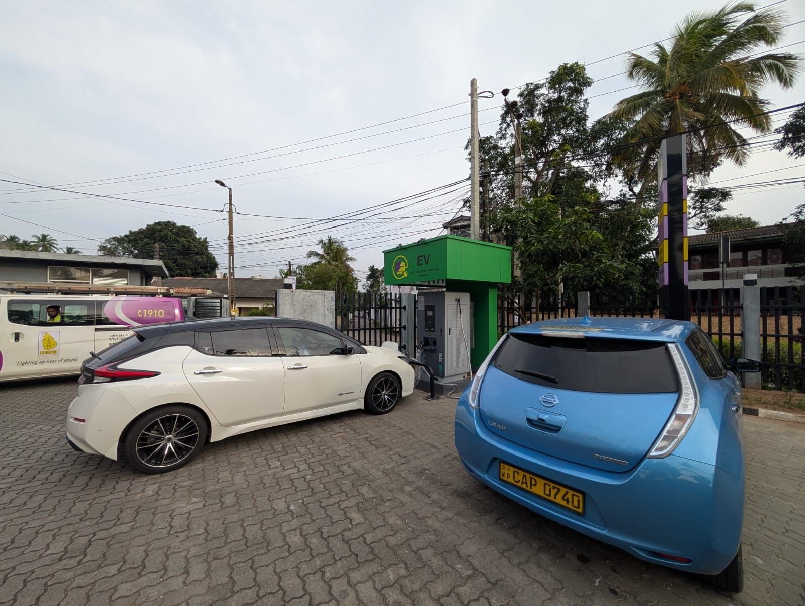 Two electric vehicles charging at a LECO fast charging station